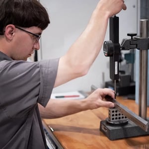 hersheys-metal-meister-factory-worker-using-hand-machine-on-metal-02